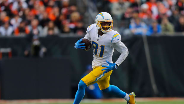 Dec 5, 2021; Cincinnati, Ohio, USA; Los Angeles Chargers wide receiver Mike Williams (81) runs with the ball against the Cincinnati Bengals in the second half at Paul Brown Stadium. Mandatory Credit: Katie Stratman-USA TODAY Sports